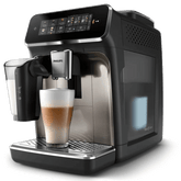 A Philips Series 3300 fully automatic espresso machine with a cup of coffee in front, displayed in a kitchen setting.