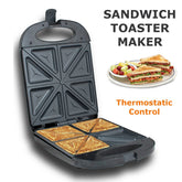 Sandwich toaster maker with a plate of sandwiches and fruit on a white background