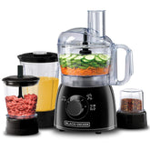 Black+Decker food processor with various attachments on a white background