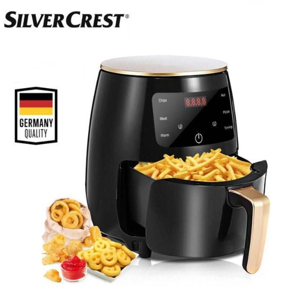 Black air fryer with food inside, brand 'SilverCrest' displayed, Germany quality badge.